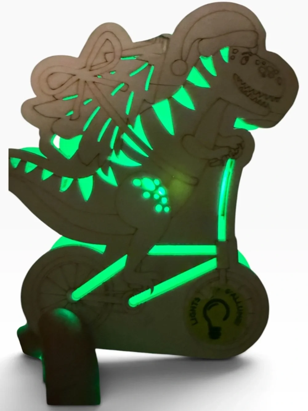 Cut out wood Dino on bike carrying a Christmas tree,
